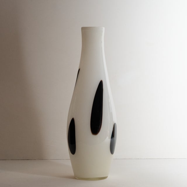 Elegant white and black blown glass vase.