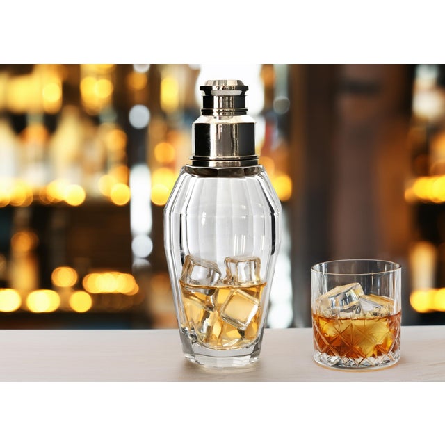 This impressive oversized cocktail shaker stands 10.5" tall and is crafted from exceptionally heavy cut crystal,...