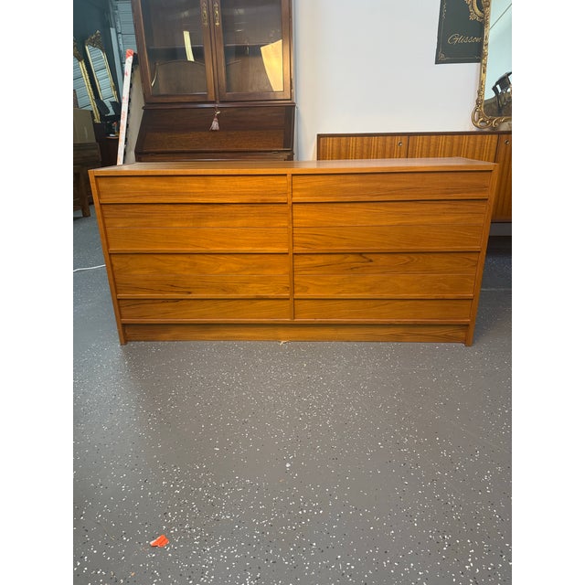 A vintage Mid-Century Modern teak double dresser from Denmark with beautiful wood grain. Both gorgeous and functional,...