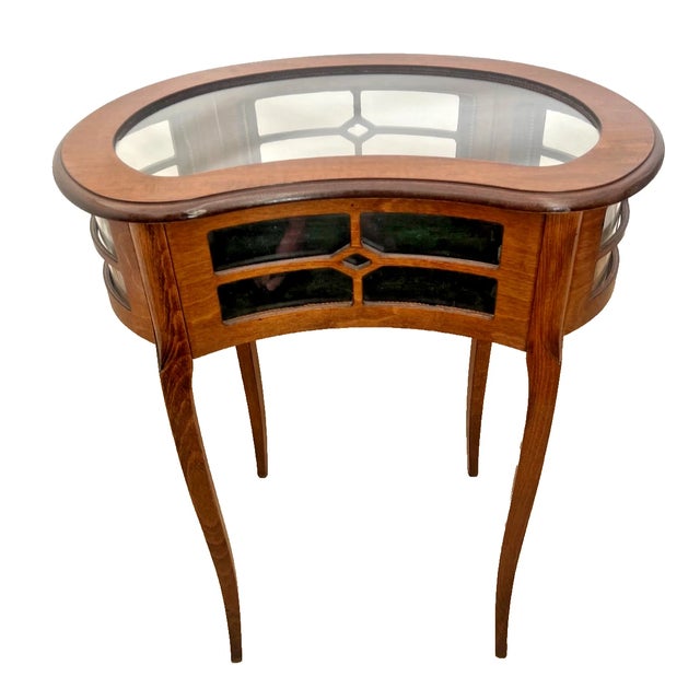 Elevate your interior curation with this exquisite Italian glass-top display table. Masterfully crafted in Italy during...