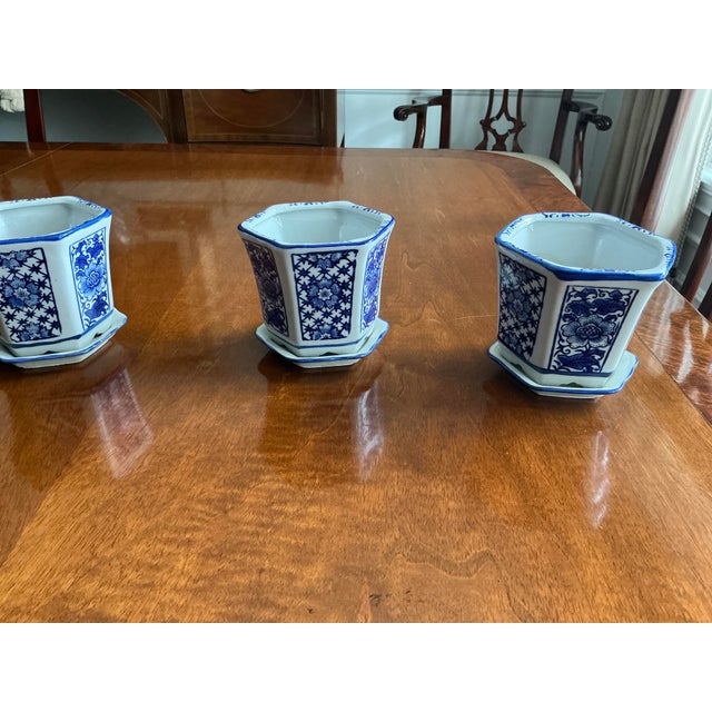 Darling petite blue and white porcelain hexagonal miniature cachepot planters. The design features a traditional floral...