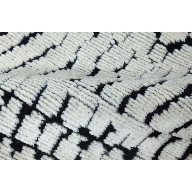 Contemporary 'Society' black and white handmade wool rug by Doris Leslie Blau. Size: 13'4" × 23'2" (406 × 706 cm) The...
