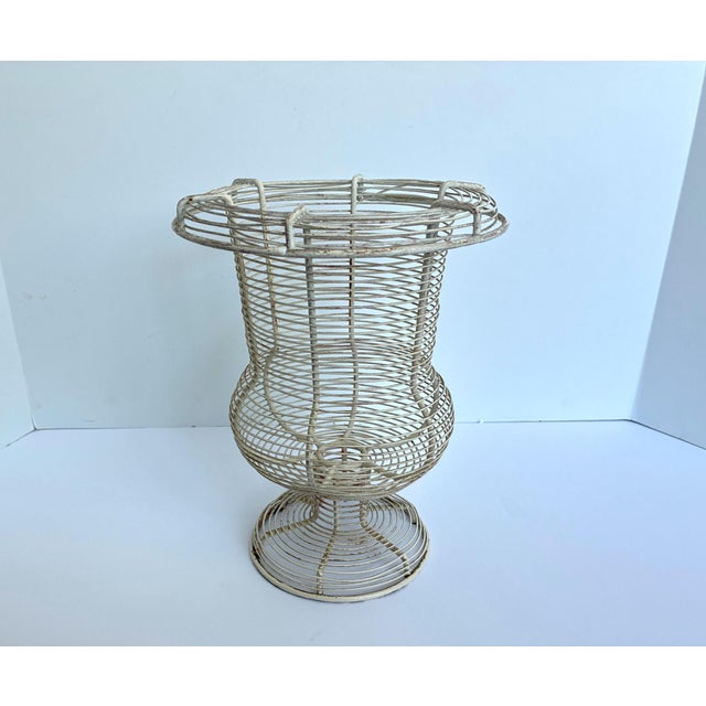 Vintage French wire metal urn shaped basket. Used for a garden planter, collecting eggs, for use as a fruit basket, or as...
