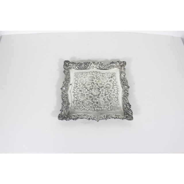 Vintage heavy, square silver plated tray with an ornate detailed edge and an embossed or engraved base. In very good,...