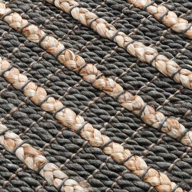 Hand woven jute rug in a muted navy blue and natural jute striped pattern. Available in numerous sizes. Please note that...