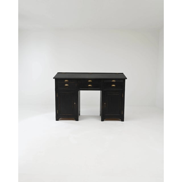 The commanding presence of this 19th-century French desk is attributed to its square pedestal structure. The ensemble of...