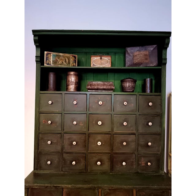 This beautiful green piece of furniture was in a rural grocery store or general store and was probably made sometime in...