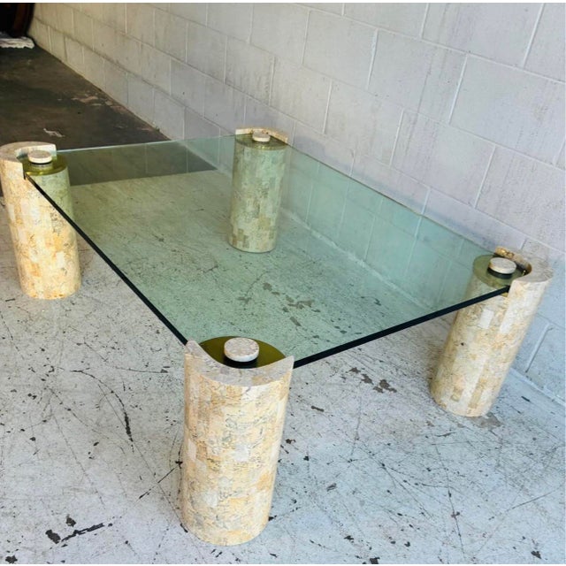 A rare, oversized four-cylinder "Bollard" cocktail table by the legendary Karl Springer (Model No. 1), circa 1980. This is...