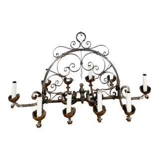 10 Light Elongated Polished Cast Iron Chandelier For Sale
