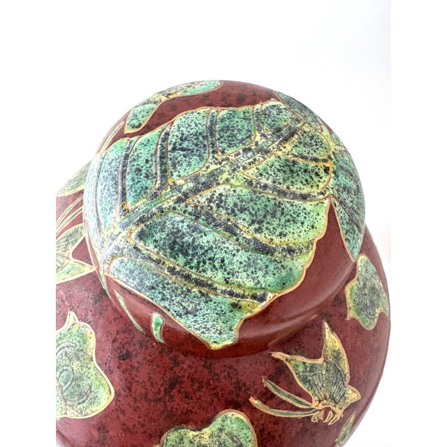 Here is a large vintage ginger jar that was made in Shanghai, China. This beautiful red jar is hand painted with green and...