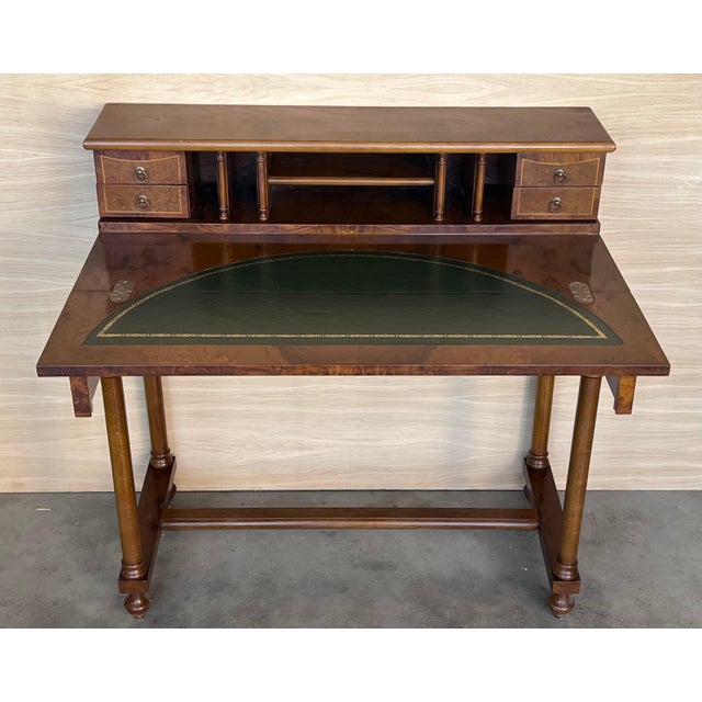 20th Century French walnut veneer and marquetry dressing table with wooden drawers crest and bronze handles.