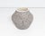 An Acoma Pueblo pottery vase by the ceramicst Debra Waconda. This vase features a rounded middle and a narrow base and...