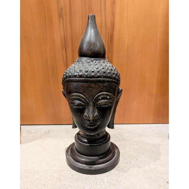 Traveling Man Treasures is selling this fine bronze Burmese Buddha head fragment cast featuring iconic Shan design...