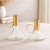 Add sleek modern elegance to your decor with this Modern Metal Taper Candle Holder with Glass Base set. Featuring a...