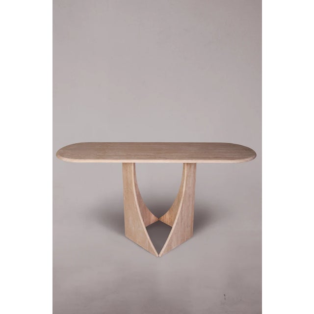 Introducing our exquisite Travertine Console Table featuring legs reminiscent of penguin feet. Crafted with precision and...