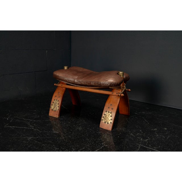 An authentic piece from the 1980s, this Egyptian camel stool combines traditional craftsmanship with decorative elegance....
