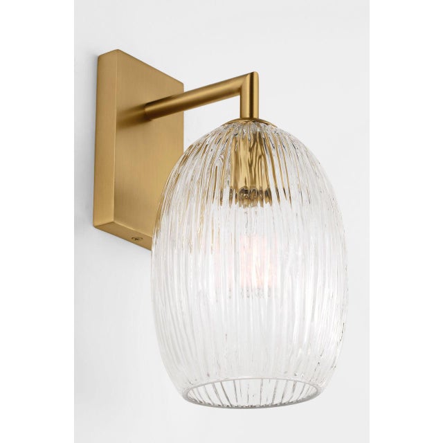 Serafina 10-inch Sconce by Hable brings sculptural elegance to the wall with a soft, organic silhouette inspired by the...