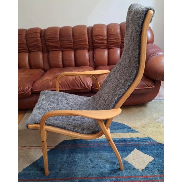 Lounge chair designed by Yngve Ekström for Swedese, Sweden, 1970s. The chair has an oak frame with sheep's wool seat which...