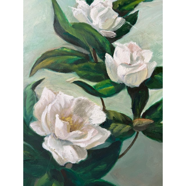 A charming 1970s vintage oil on canvas still life featuring elegant white blossoms set against a soft muted green...