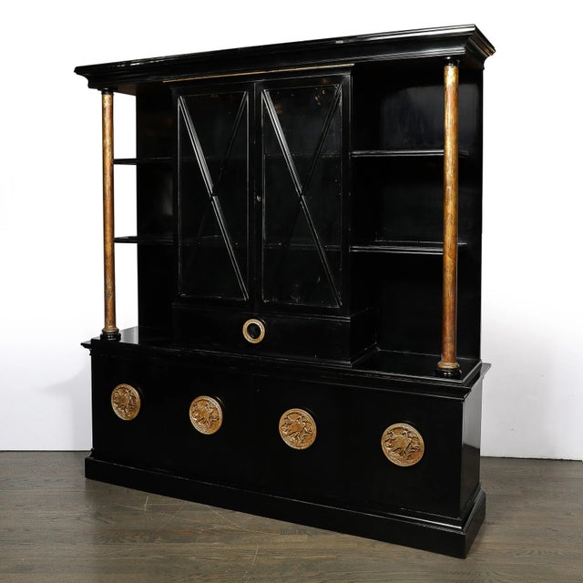 This impressive and rare Mid-Century Modernist Cabinet by James Mont in Black Lacquered Walnut W/Gilt Carved Handles...