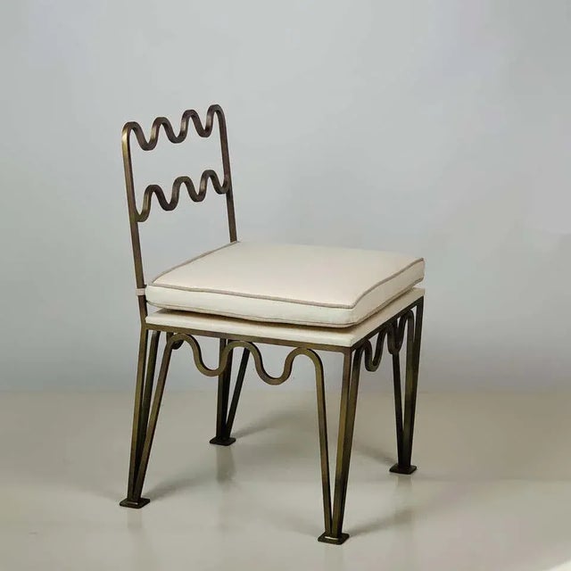 Pair of chic undulating 'Méandre' side chairs by Design Frères. Gorgeous hand applied gilt bronze patina over steel...