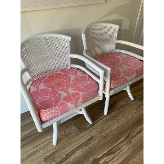 Vintage White Bamboo Swivel Chairs With Floral Pink Seat Cushions a