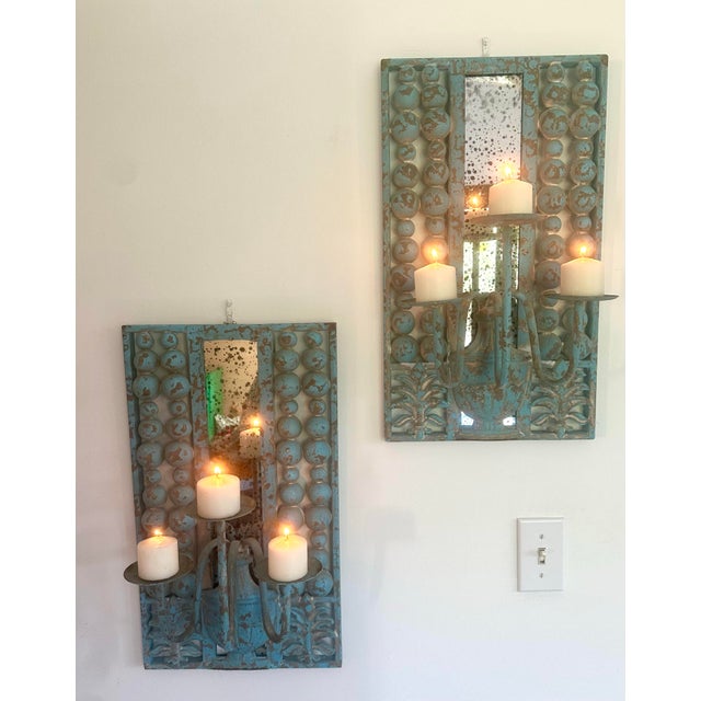 From my own collection, these candle sconces are so artistic and unique. Cast iron finished with a chippy turquoise blue...