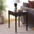 Add sophistication and warmth to any room with the Neha Accent Table. Crafted in a rich, dark chocolate finish, this...