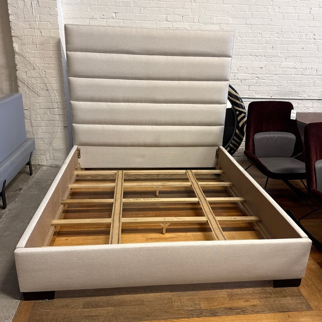 Design Plus Gallery presents a Custom California King Upholstered Bed Frame. The bed is fully upholstered in a neutral...