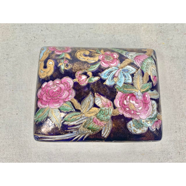 Lovely vintage ceramic box. Chinoiserie floral design in pink, gold, green and tan and navy. Perfect to use as a small...