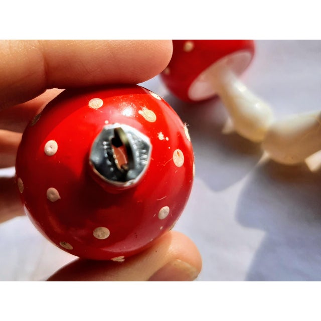 Transform your holiday décor with our adorable vintage-inspired red mushroom ornaments, adorned with whimsical white polka...