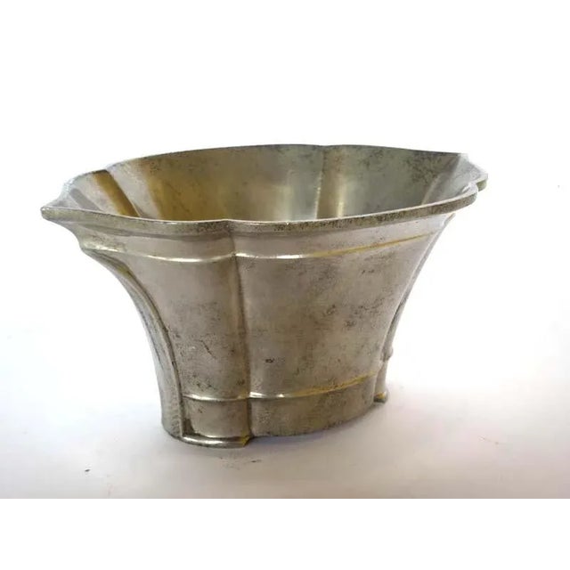 Embossed metal Manufacturing mark under the base. This piece has an attribution mark, I am sure that it is completely...