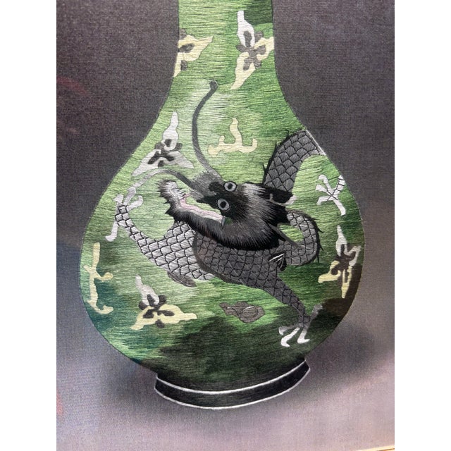 This vintage Chinese silk embroidery art features a green vase adorned with a dragon design, framed in a medium size...