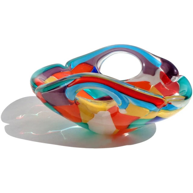 Beautiful large, vintage Murano hand blown rainbow colors Italian art glass centerpiece bowl. Created in the "Pezzato" and...