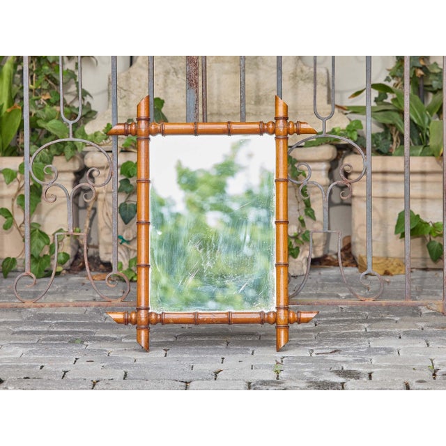 This French faux bamboo mirror from circa 1900 has all the hallmarks of turn-of-the-century bamboo-inspired carving:...