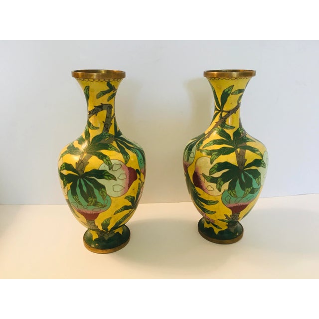 This pair of cloisonn� vases Are stamped China dating them from the 40�s The ground color is imperial yellow with...