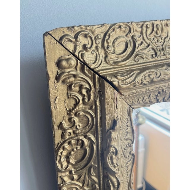 Beautiful elegant ornate floral gesso gold gilt mirror. Antique circa late 1800s. Hangs by wire at the back. Some gesso is...