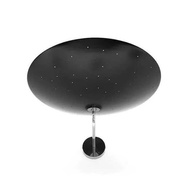 Pierre Disderot Model #2059 large perforated wall lamp in black and chrome. Originally designed in 1955, this clean and...