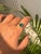 This elegant 1.9-carat oval natural emerald solitaire ring is crafted in 18K yellow gold. The emerald measures around 9.3...