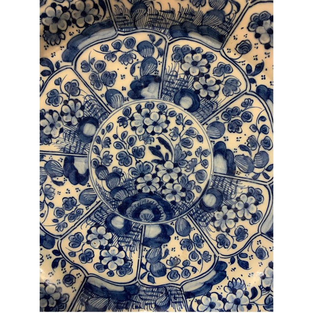 18th- 19th-century hand-painted Delft platter, 12 1/8” diameter.