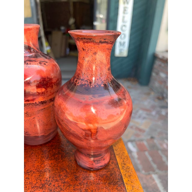 4 beautifully aged Chinese realgar peking glass vases ranging in height from 7-9 inches. Beautiful rich colors and swirls...