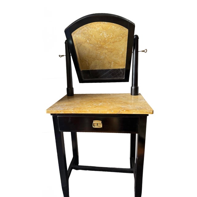 This Viennese Art Deco dressing table dates to the 1940s and features a black lacquered wooden frame combined with a warm...