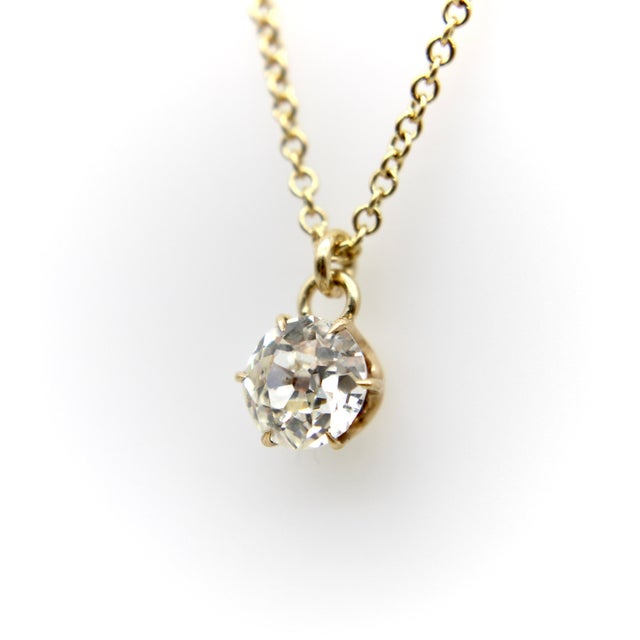 This is an Edwardian diamond in a 14k gold mount with a six-prong setting and small talon claw prongs that make the...