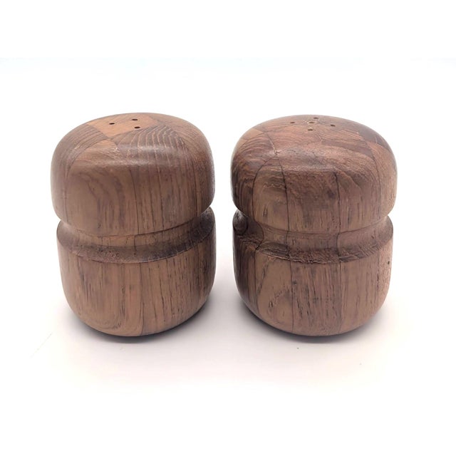 Offered is a pair of classic staved and lathed Teak wood salt and pepper shakers made in Denmark some time between the mid...