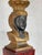 Egyptian revival carved wood lamp. The chiseled feminine ebonized face is surmounted by a gilt headdress. The body of the...