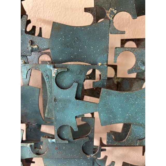 A vintage multidimensional metal wall sculpture by Mark Weinstein, as pictured in the 1974 catalog for Marc Creates....