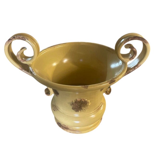 A charming ceramic trophy urn. Recently handcrafted in Italy, this piece masterfully mimics the weathered elegance of an...