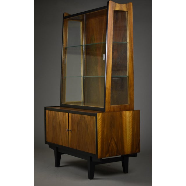 An exceptional Mid-Century Modern display case designed by Rajmund Teofil Hałas in the 1960s, an iconic figure in Polish...
