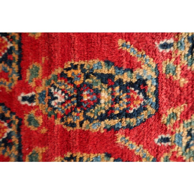 This captivating vintage Persian Hamadan rug from the 1960s is a wonderful example of enduring tribal artistry. Woven by...