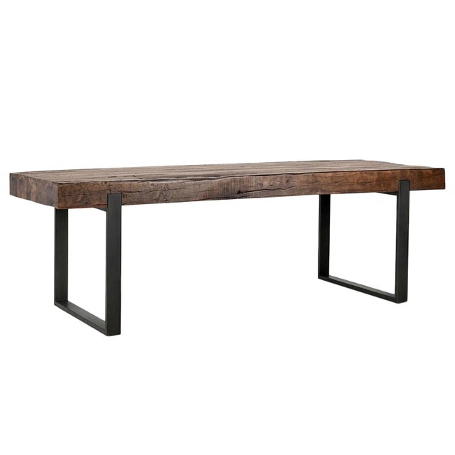 Thick reclaimed wood slab top dining table with black iron U-shape legs. Rustic modern style great for many interior...